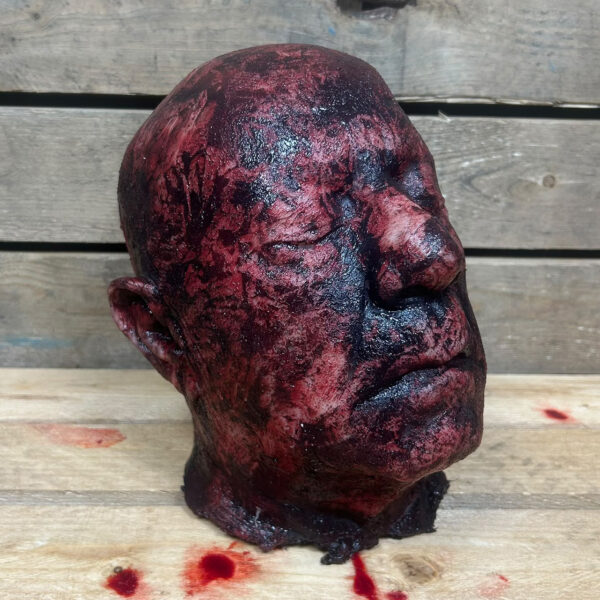 severed burned head clarence