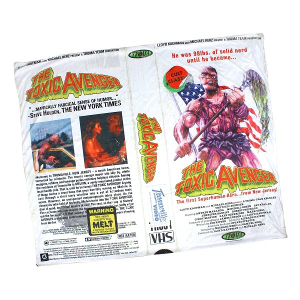 A blanket featuring a VHS style cover of the Toxic Avenger