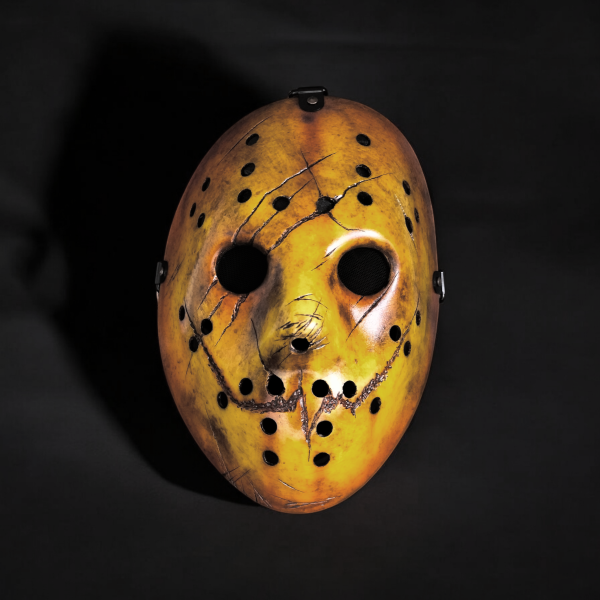 A distressed and clawed hockey mask.