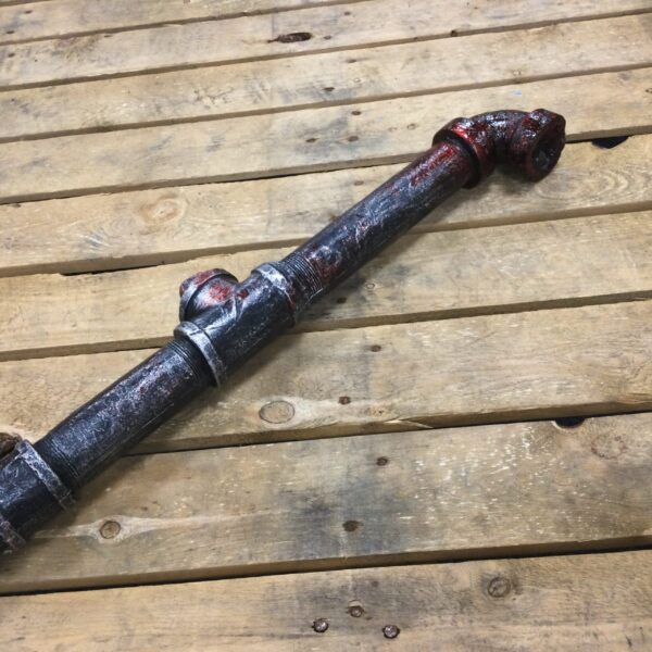 A PU foam replica metal pipe covered in blood.