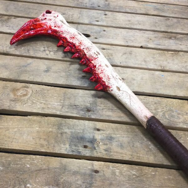 A PU foam weapon made from the large jaw of an animal.