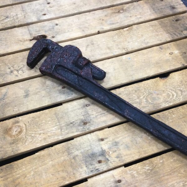 A PU foam replica wrench covered in blood for Halloween use.