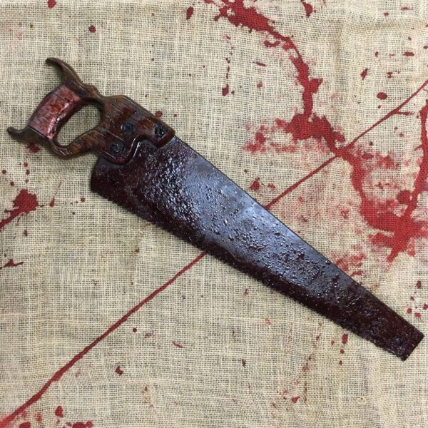 Premium Bloody Hand Saw halloween prop.