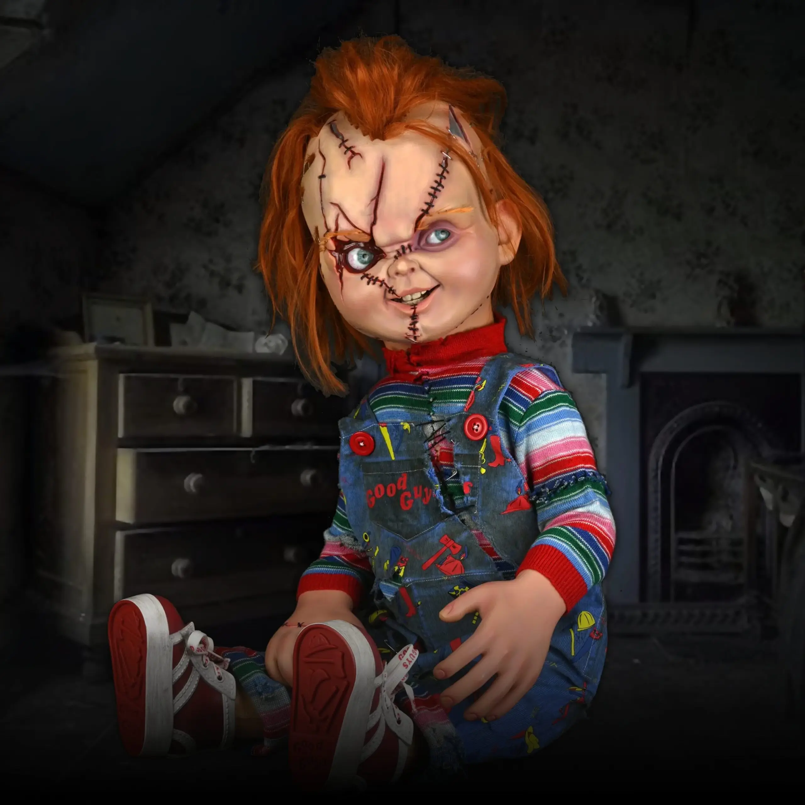 Life-size Chucky Good Guy doll replica photographed against a dark background